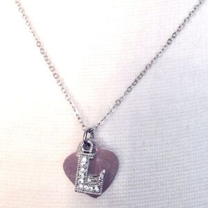 Silver heart necklace with "L" charm